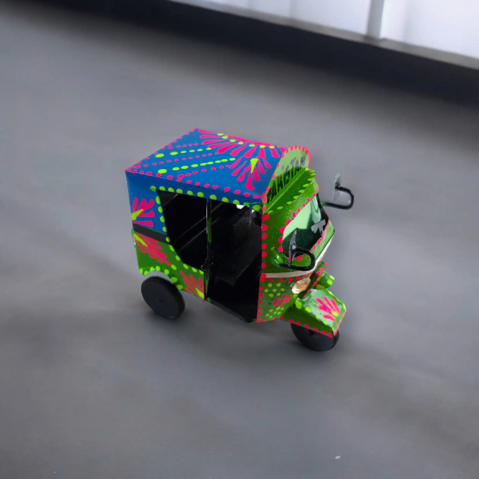 Neon Rickshaw: A Vibrant Mini Auto-Rickshaw Model